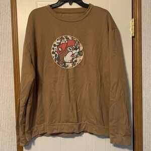 Brown Buc-ee’s sweater SizeL
Length 24’
Bust 26’
Sleeve length 22